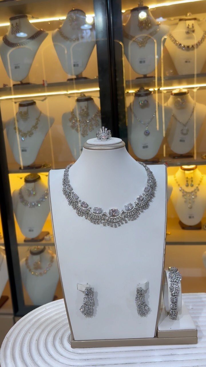 Crystal Jewelry Sets for 6 Style Moods 5 Silver crystal necklace, earrings, and bracelet set displayed on a white jewelry bust.