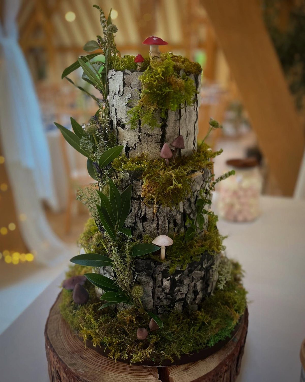 11 Forest Theme Wedding Ideas for a Natural Woodland Ceremony 2 A birch tree themed wedding cake decorated with green moss and small mushrooms.