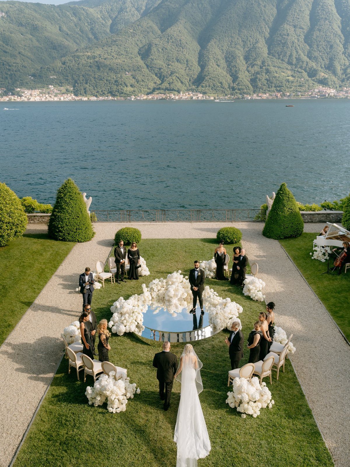 Garden Wedding Ceremony: 9 Ideas for Intimate Outdoor Vows 1 A wedding ceremony on a lawn with a mirror altar overlooking a lake and mountains.